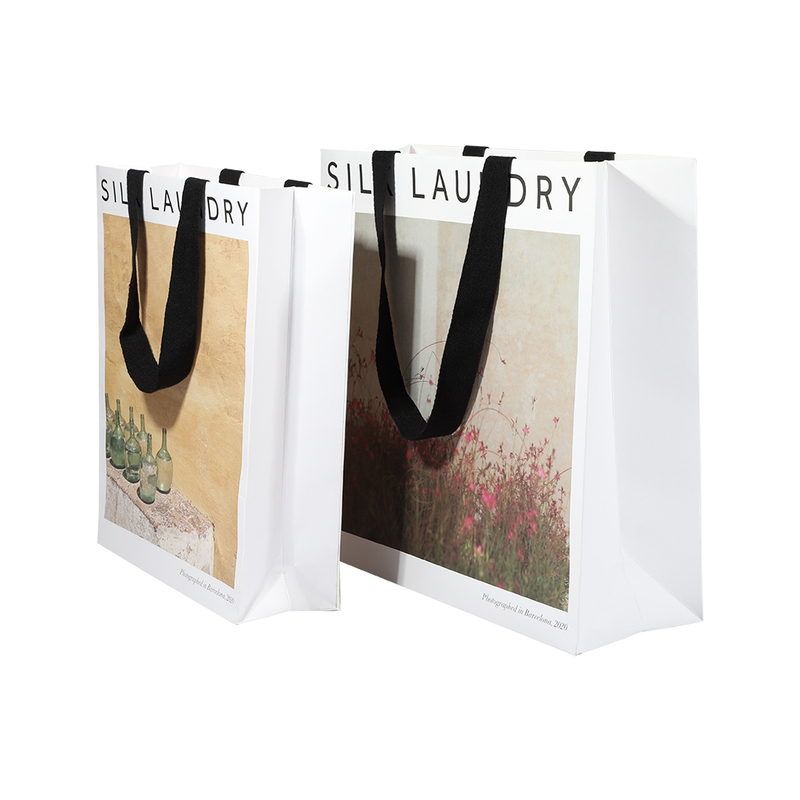 Leverant&ouml;r av anpassade vita presentpappersp&aring;sar